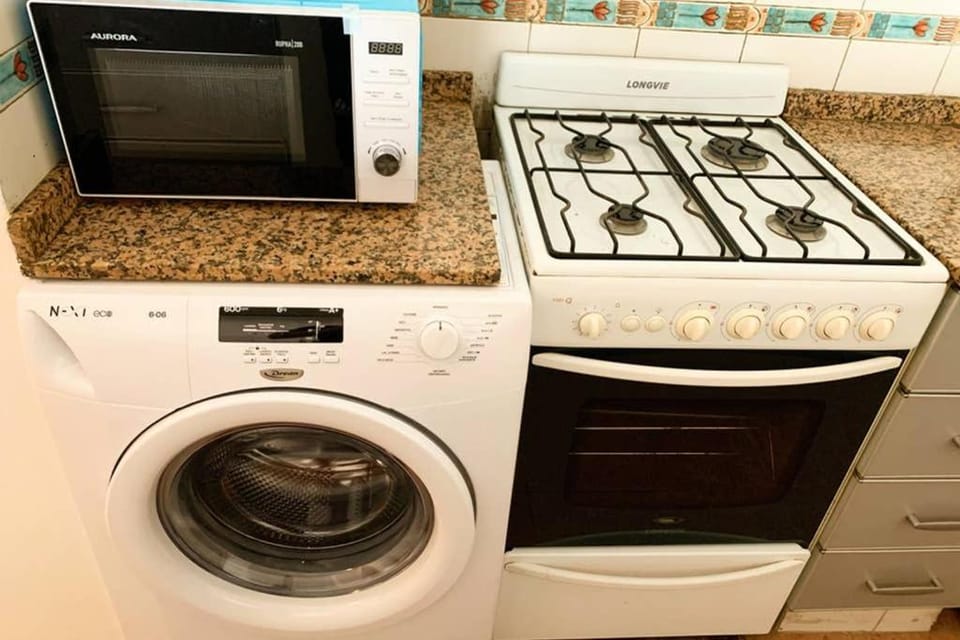 Kitchen or kitchenette, washing machine
