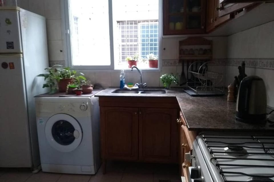 Kitchen or kitchenette, washing machine