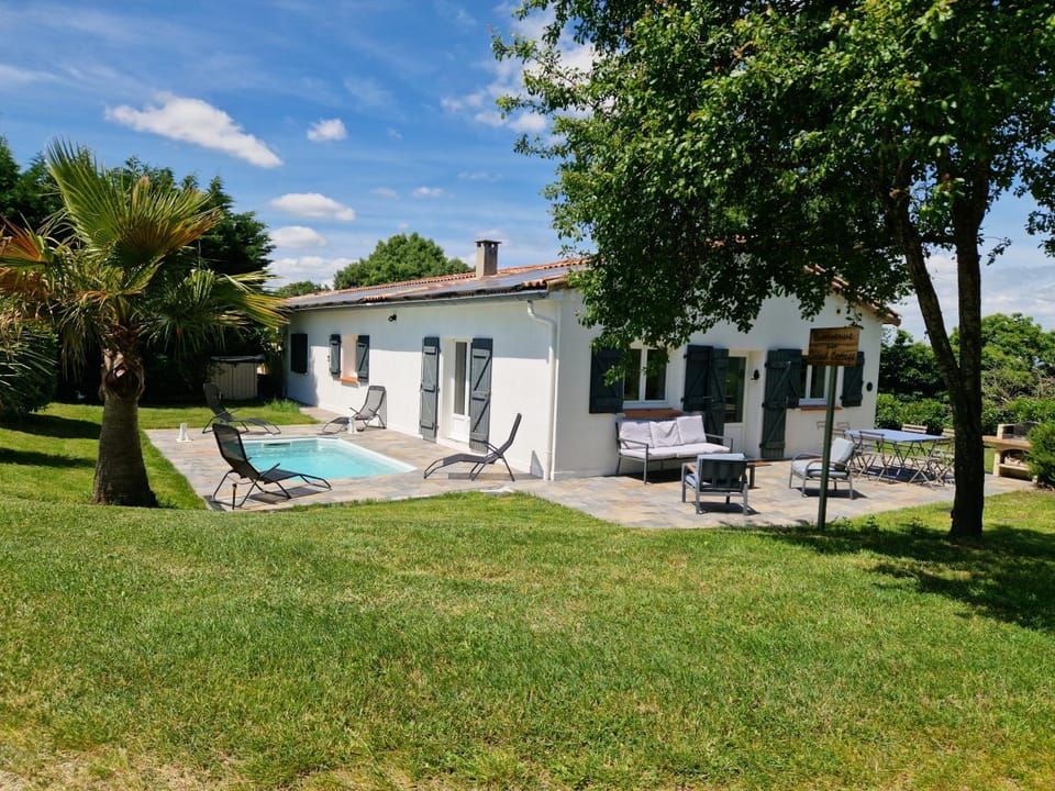 Property building, Patio, Spring, Day, Natural landscape, Garden, Garden view, Pool view, Swimming pool, pet friendly, sunbed