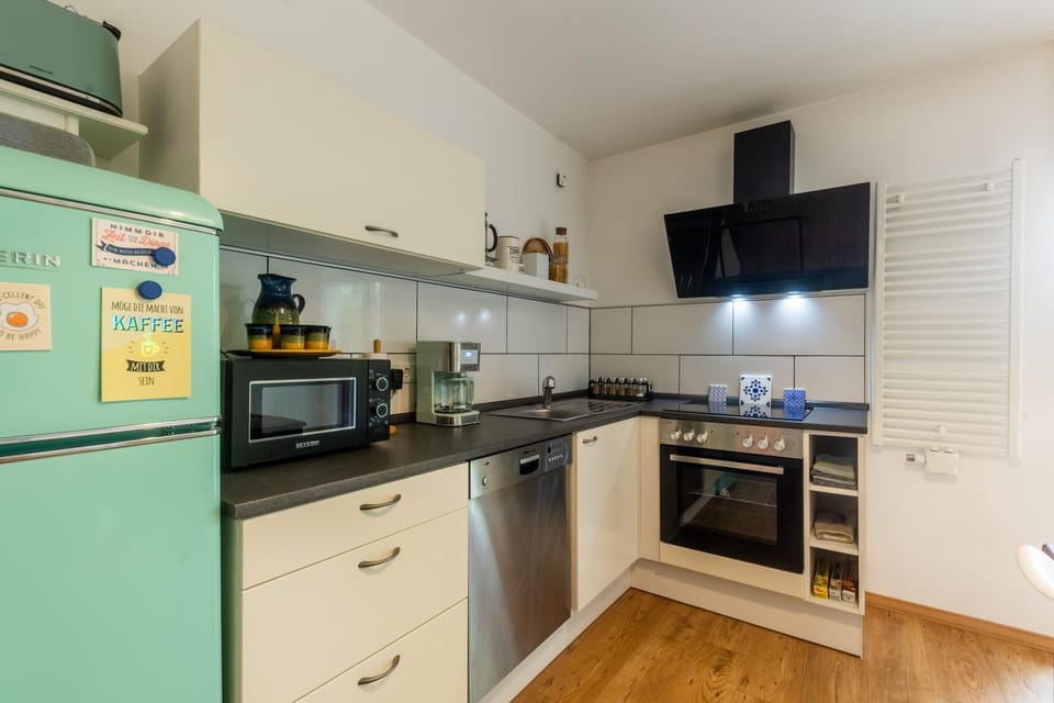 Kitchen or kitchenette, dishwasher, oven, stove, toaster