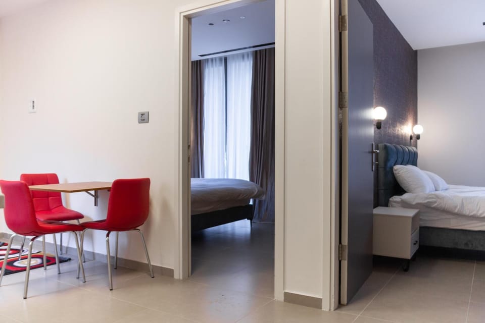 Bed, TV and multimedia, Living room, Seating area, Bedroom