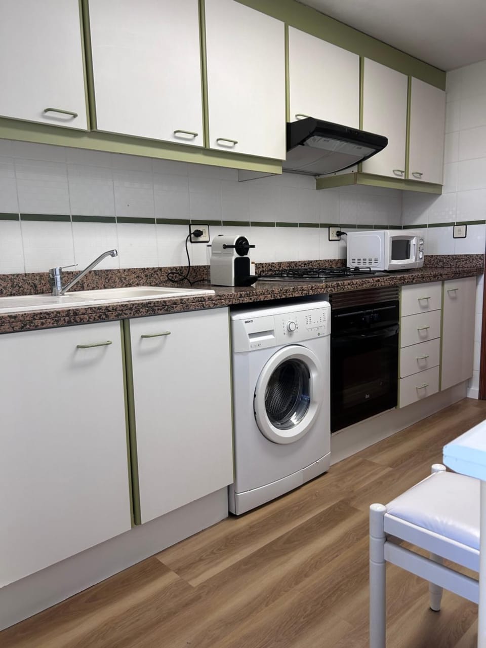 Kitchen or kitchenette, microwave, oven, washing machine