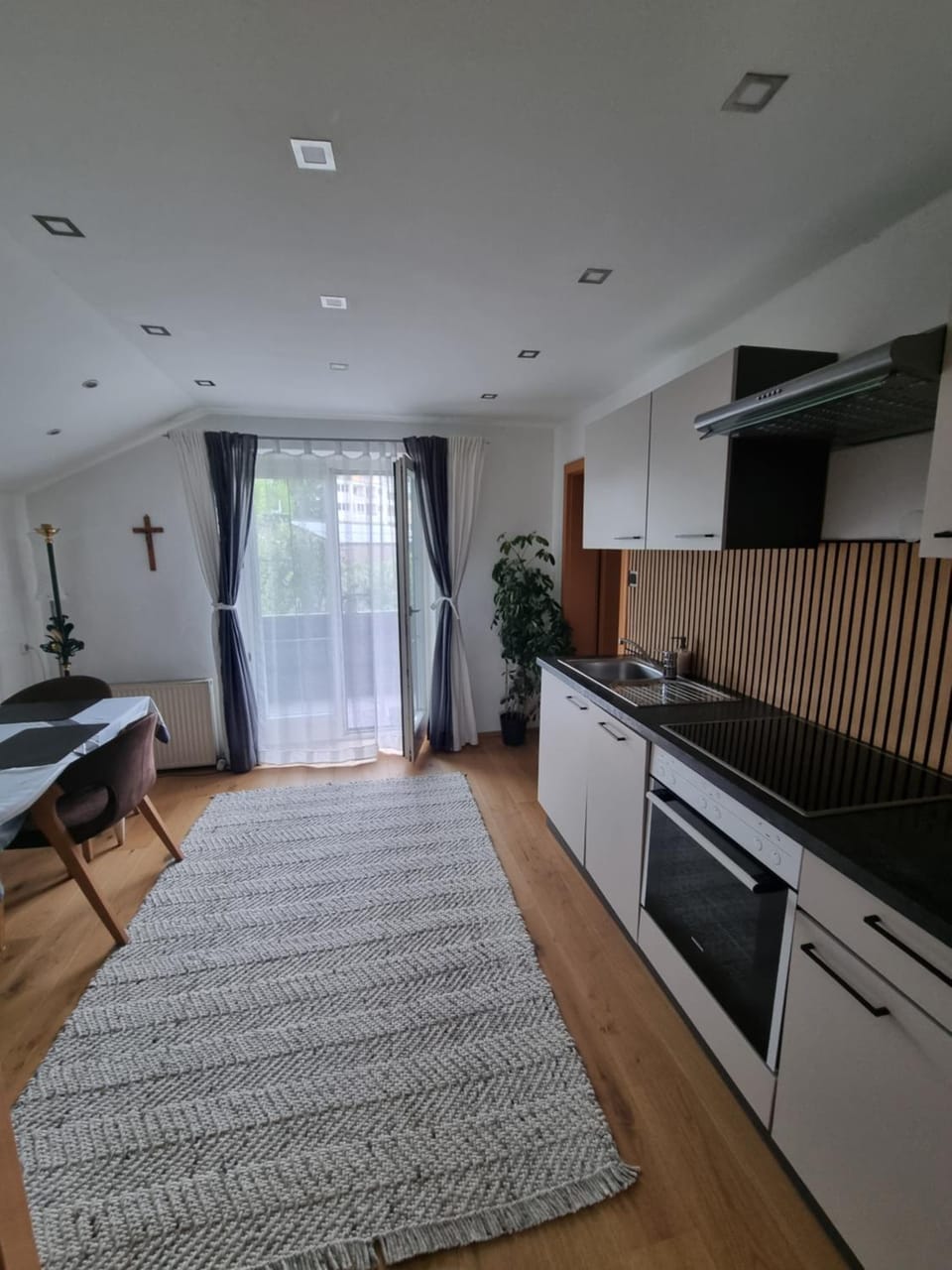 Kitchen or kitchenette, dishwasher, oven, stove