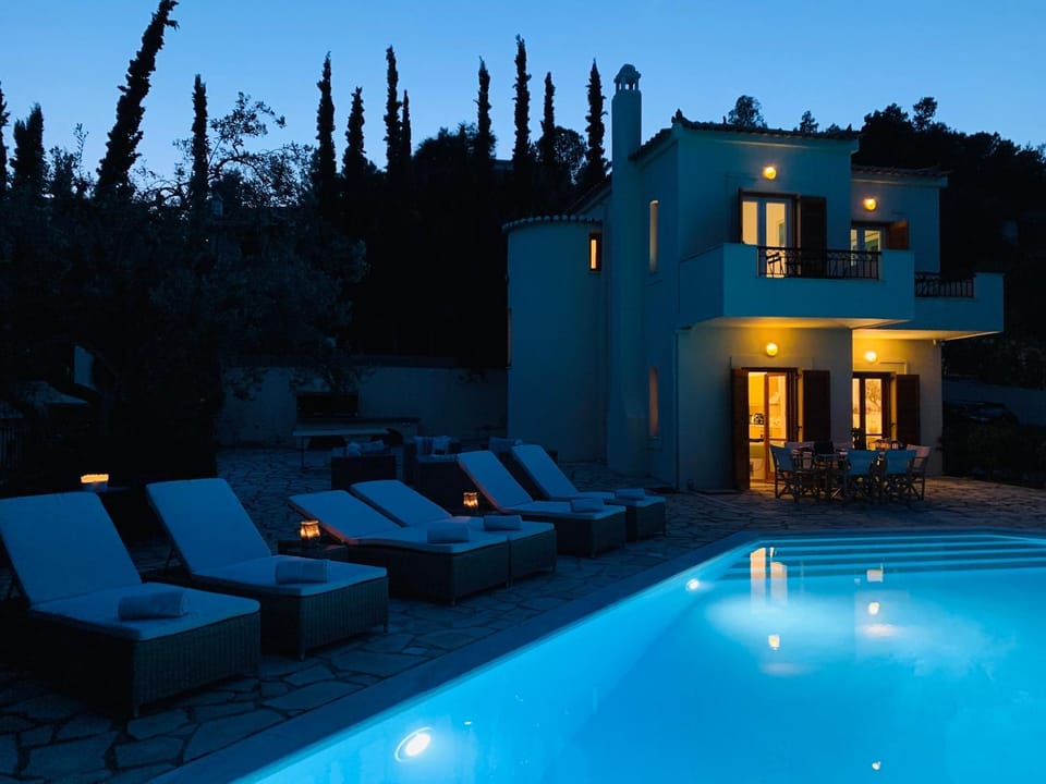 Property building, Patio, Night, Swimming pool, sunbed
