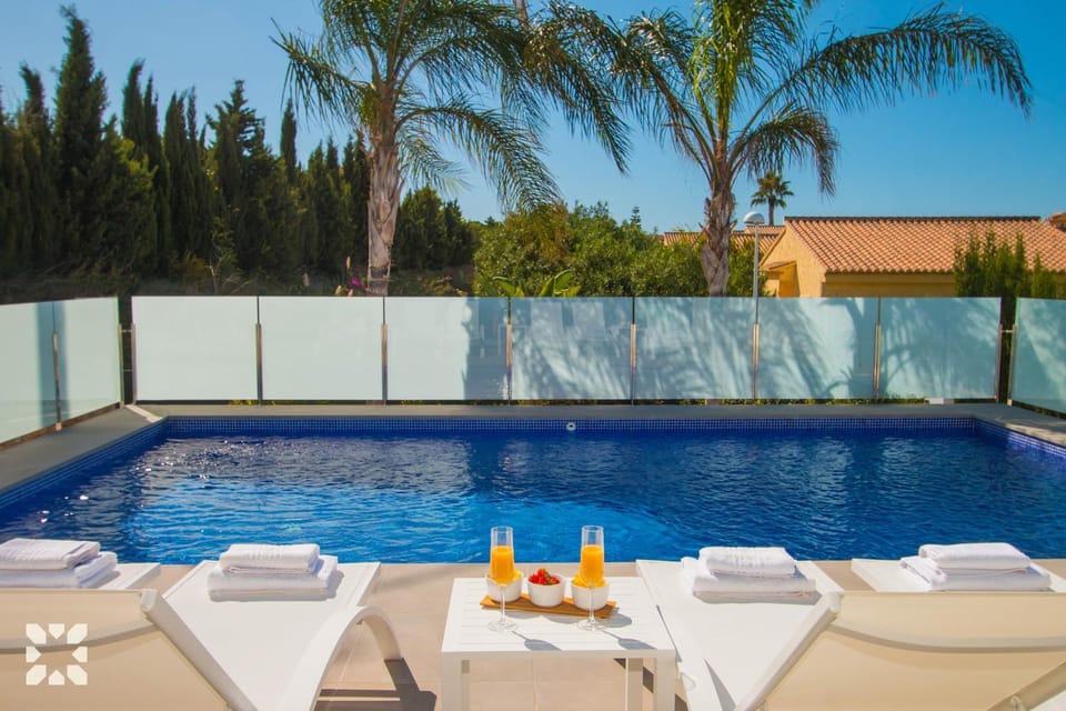Patio, Day, Natural landscape, Pool view, Swimming pool, sunbed