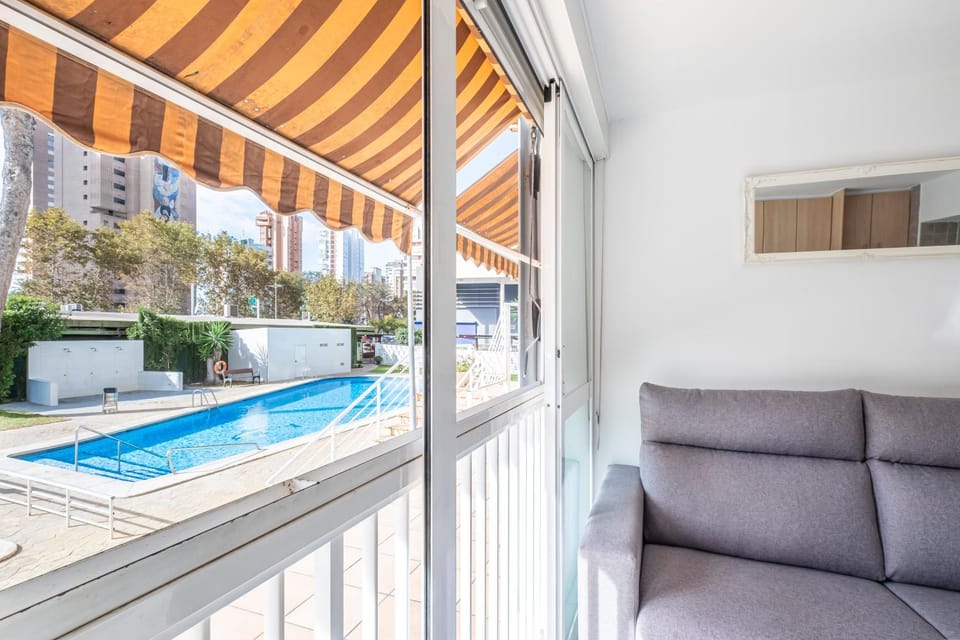 Day, View (from property/room), Living room, Pool view, Swimming pool