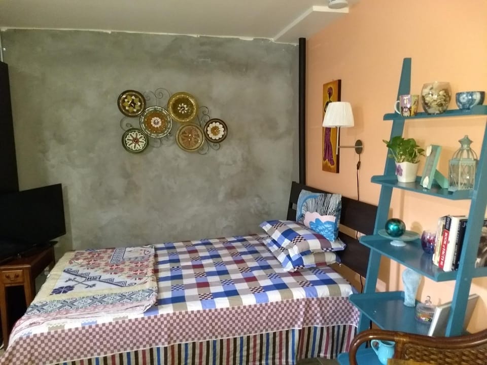 Bed, Seating area, Bedroom, Entertainment