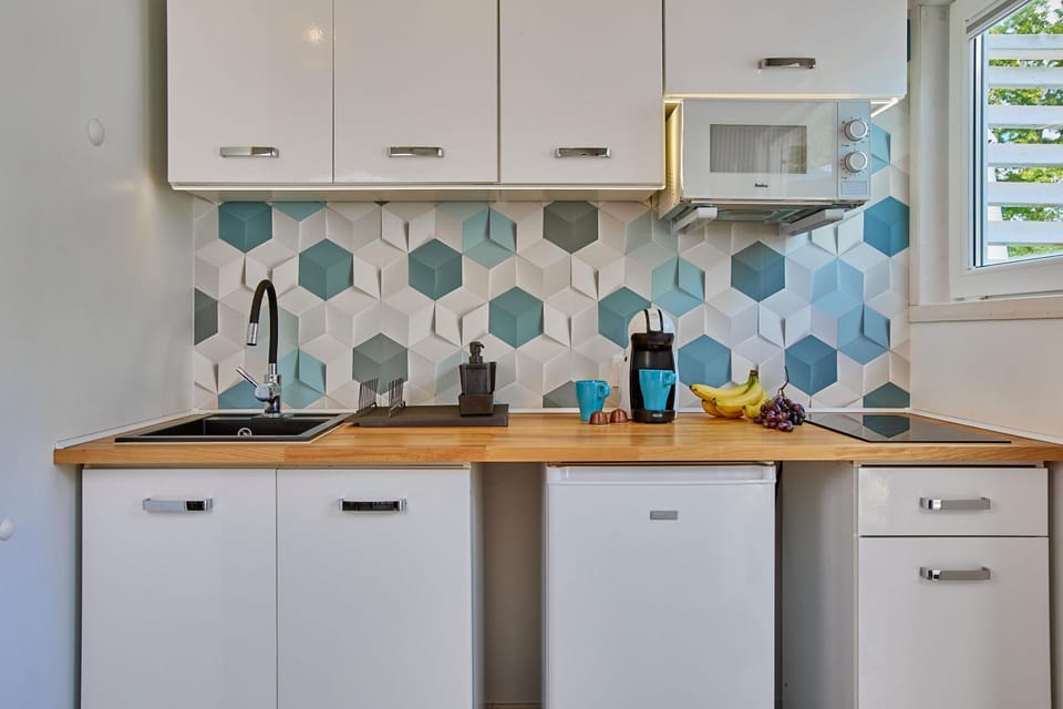 Kitchen or kitchenette, microwave, oven, stove, toaster