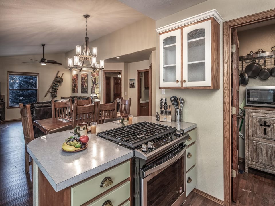 Kitchen or kitchenette, Living room, Seating area, Dining area, furniture, microwave, stove, wardrobe
