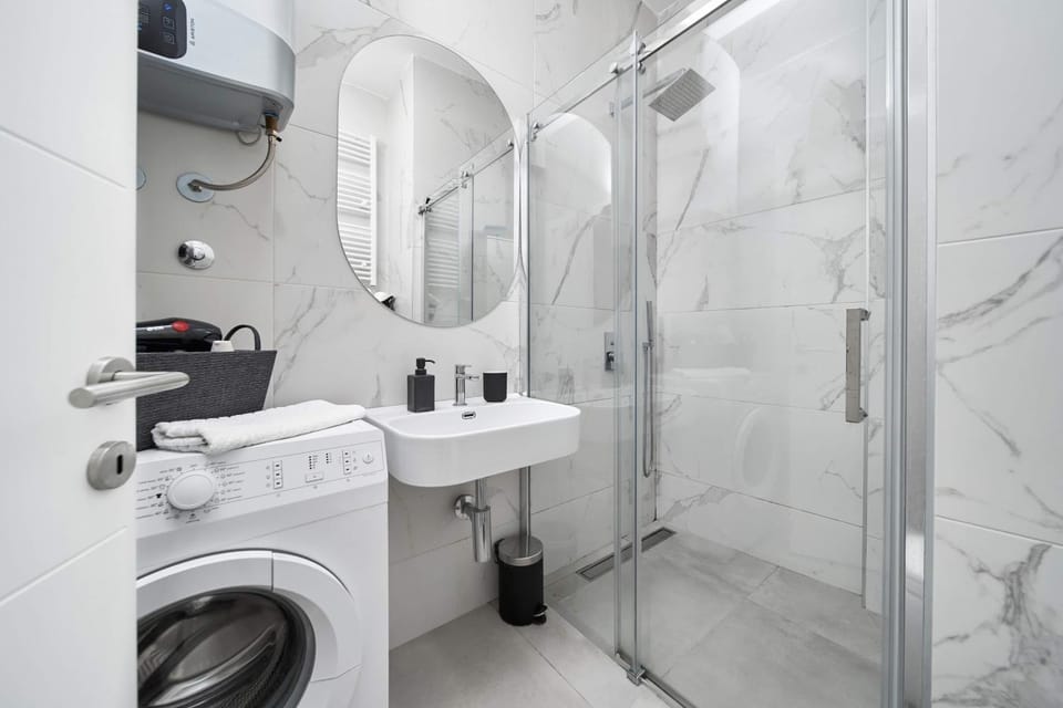 Shower, Toilet, Bathroom, towels, washing machine, dryer