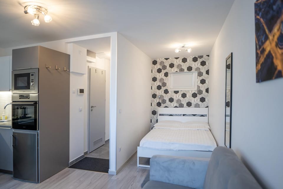 Bed, Kitchen or kitchenette, microwave, oven