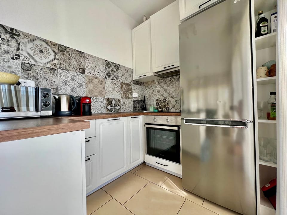 Kitchen or kitchenette, dishwasher, oven, stove, toaster