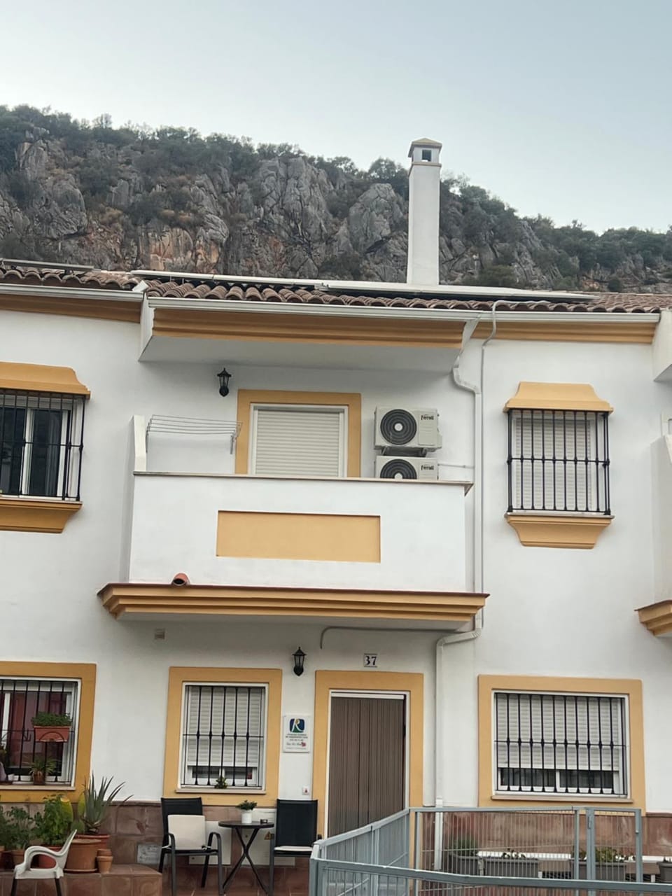 Property building, air conditioner, air conditioner