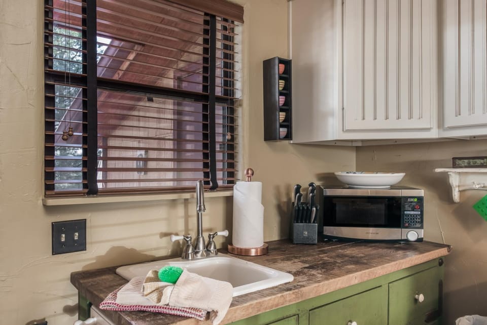 Kitchen or kitchenette, furniture, microwave, towels