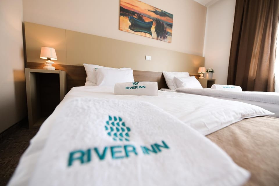 Bed, Property logo or sign, Living room, Bedroom, Guests, towels