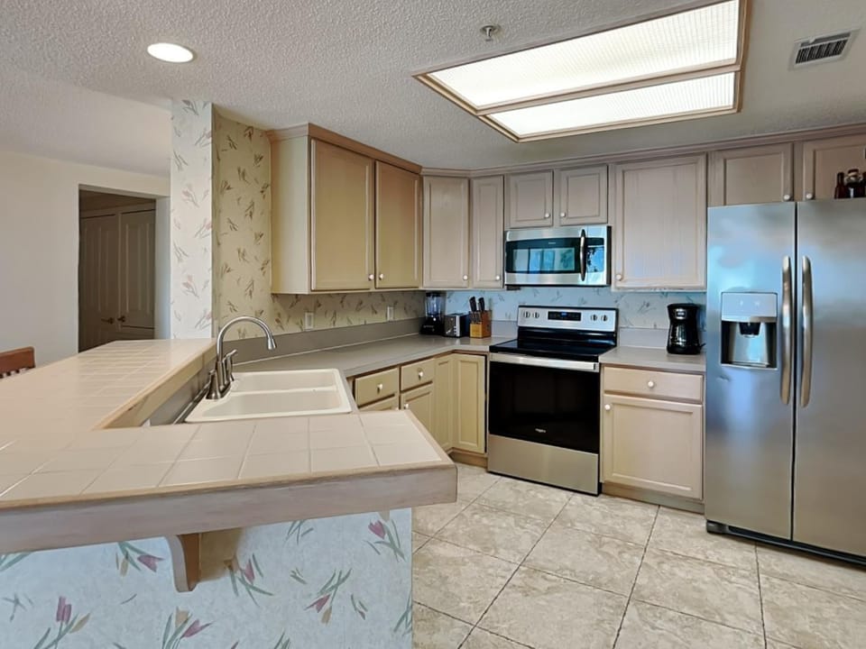 Kitchen or kitchenette, dishwasher, microwave, oven, stove, kitchen