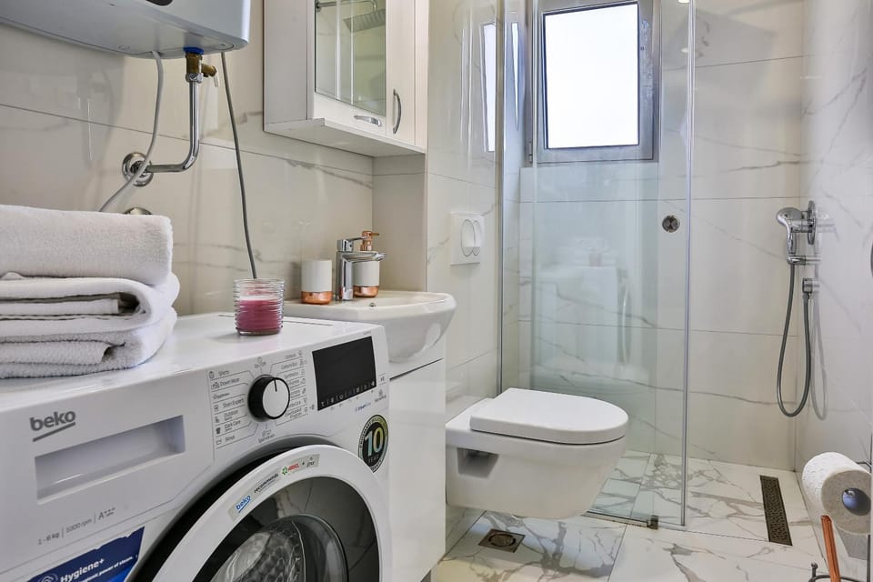 Shower, Toilet, Bathroom, towels, washing machine, dryer