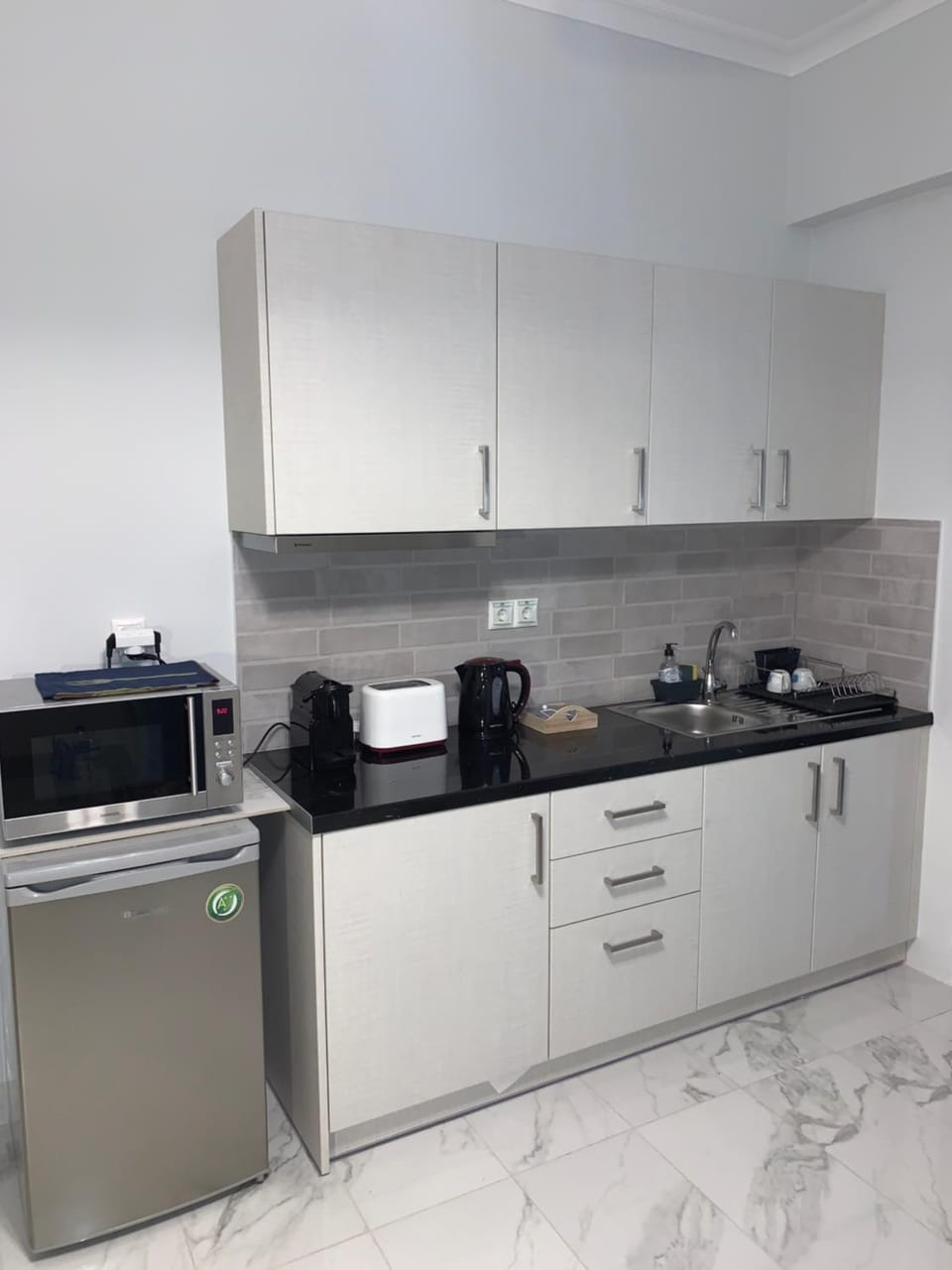 Kitchen or kitchenette, microwave, toaster