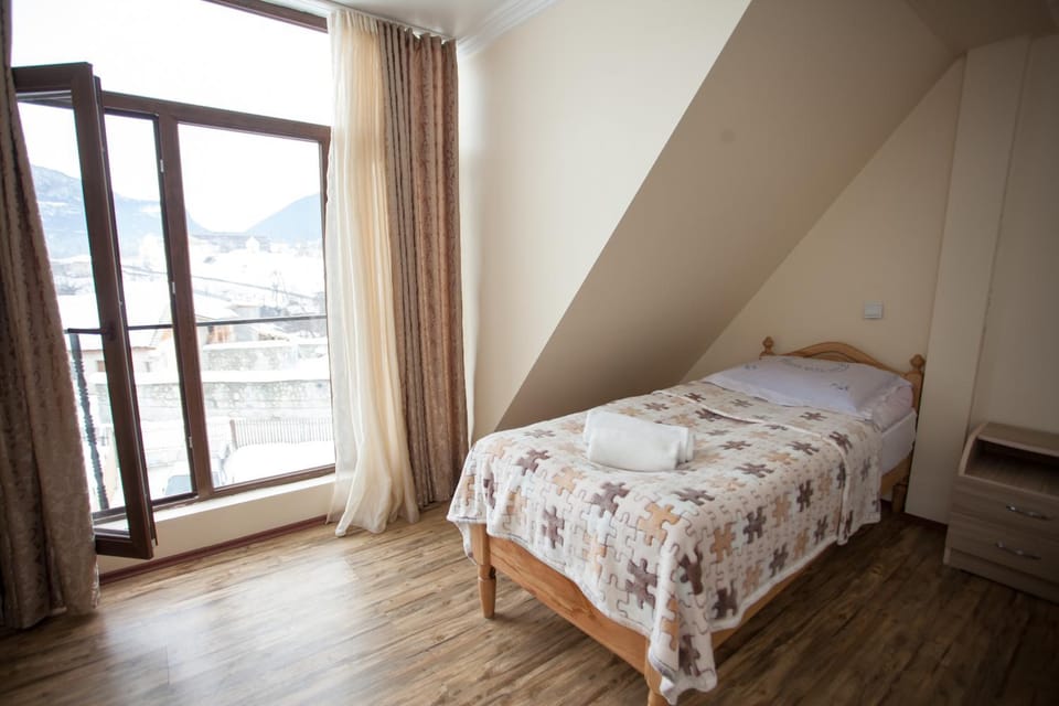 Staff, Staff, Bed, People, People, Bedroom, Garden view, Landmark view, Mountain view, Street view, Family, Family