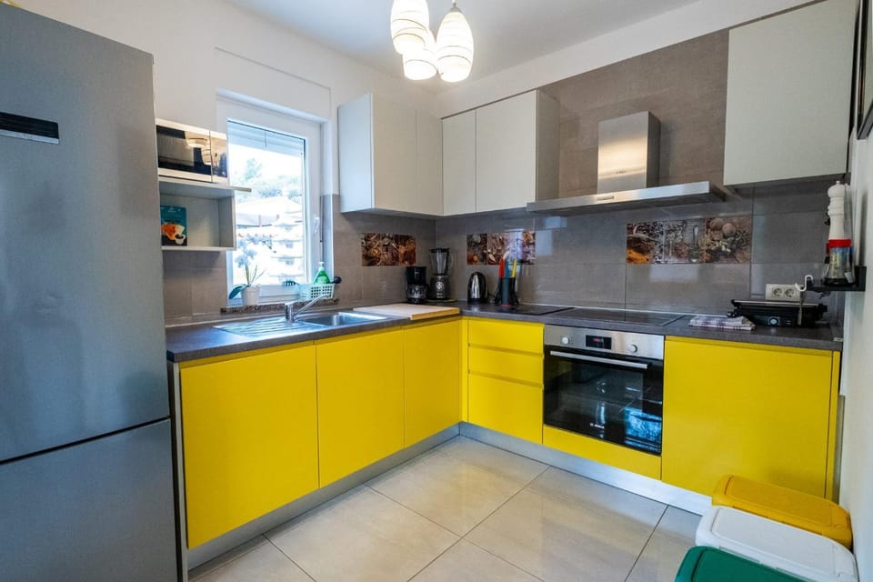 Kitchen or kitchenette, dishwasher, oven, stove, toaster
