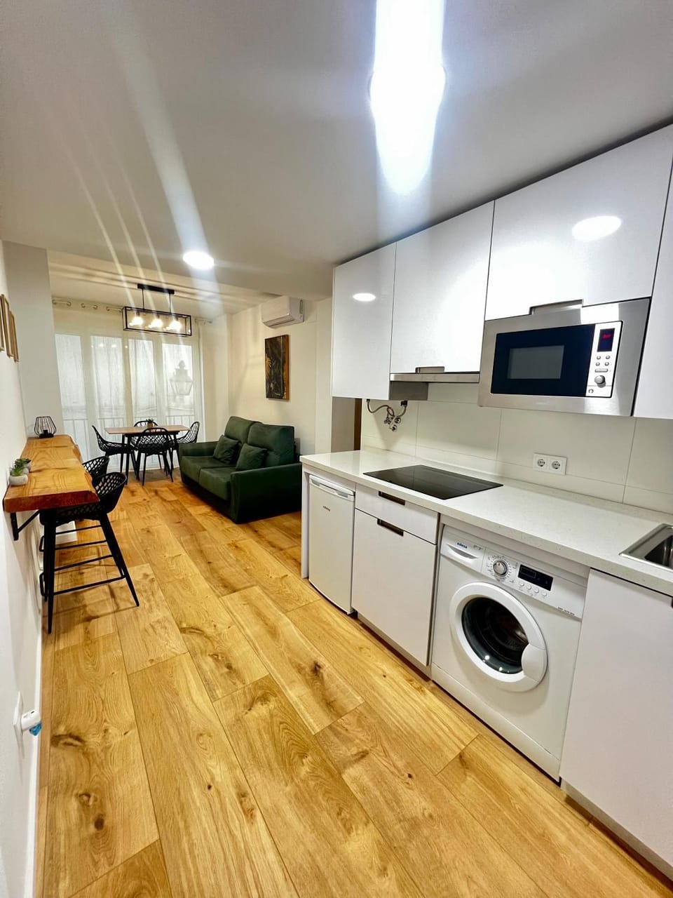 Kitchen or kitchenette, Living room, Seating area, Dining area, stove, washing machine