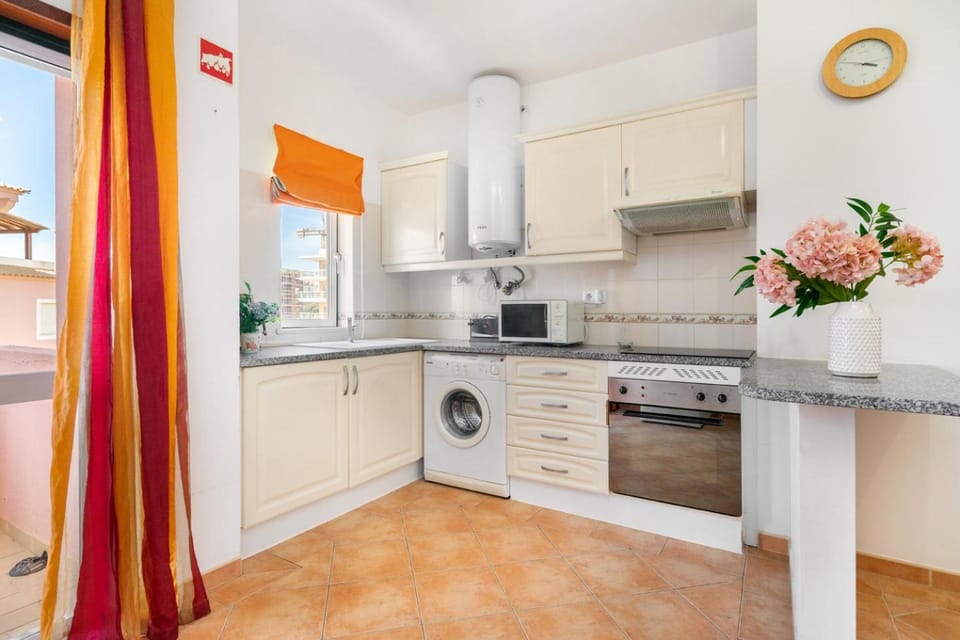 Kitchen or kitchenette, oven, stove, washing machine