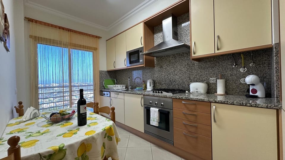Kitchen or kitchenette, dishwasher, oven, stove, toaster