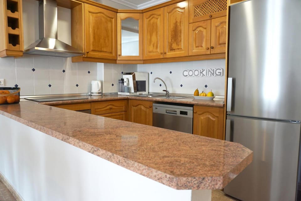 Kitchen or kitchenette, dishwasher, stove