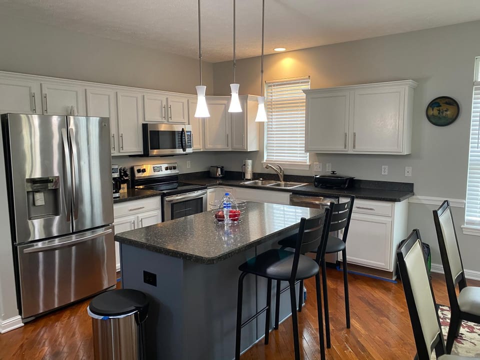 Kitchen or kitchenette, dishwasher, oven, stove, toaster