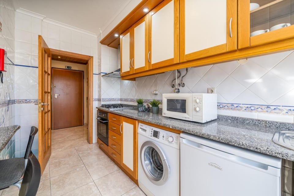 Kitchen or kitchenette, dishwasher, minibar, oven, stove, washing machine, dryer
