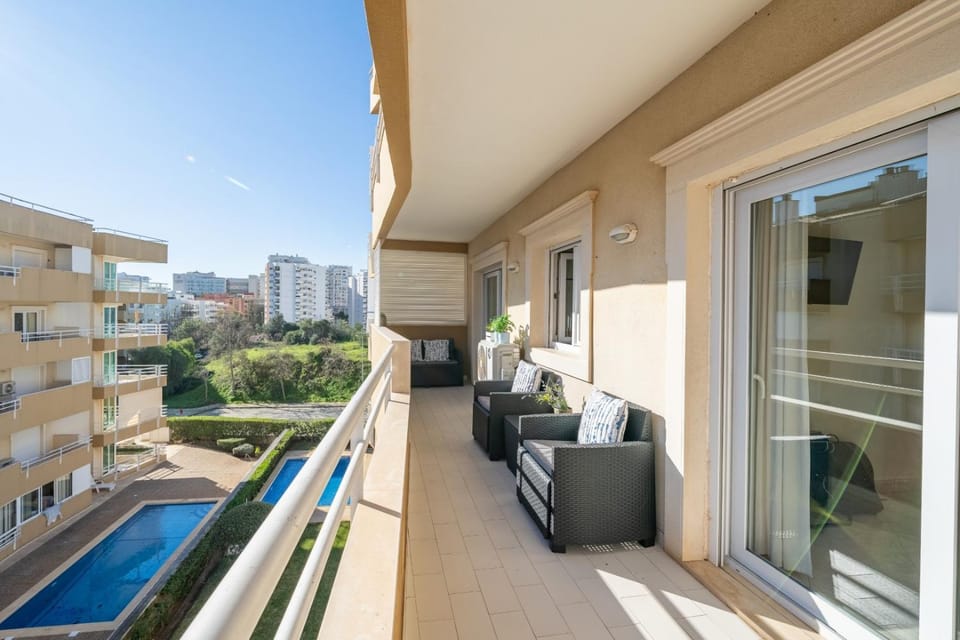 Property building, Patio, Day, View (from property/room), Balcony/Terrace, Living room, Seating area, Pool view, Swimming pool