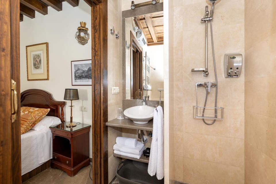 Shower, Toilet, Bathroom, hair dryier, towels