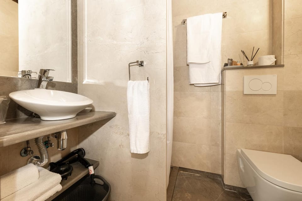 Bathroom, hair dryier, towels