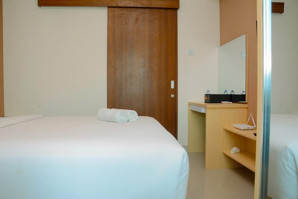 Minimalist and Homey 1BR Grand Kamala Lagoon Apartment By Travelio Apartment in West Java