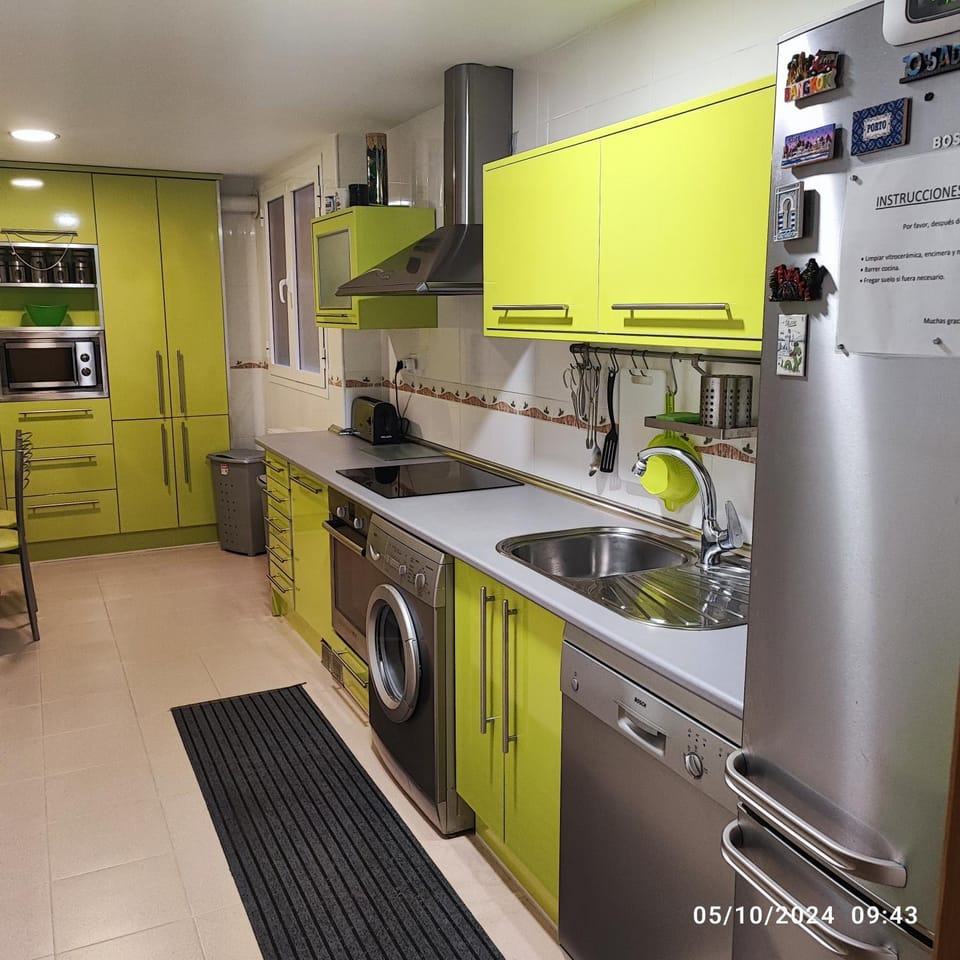 Kitchen or kitchenette, stove, toaster, washing machine