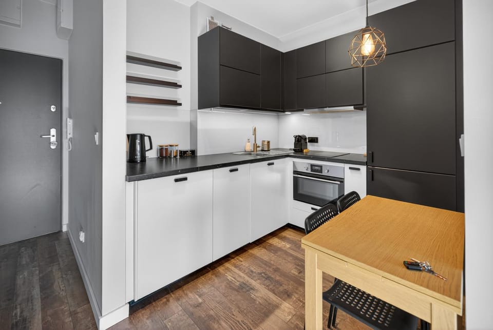 Kitchen or kitchenette, dishwasher, oven, stove