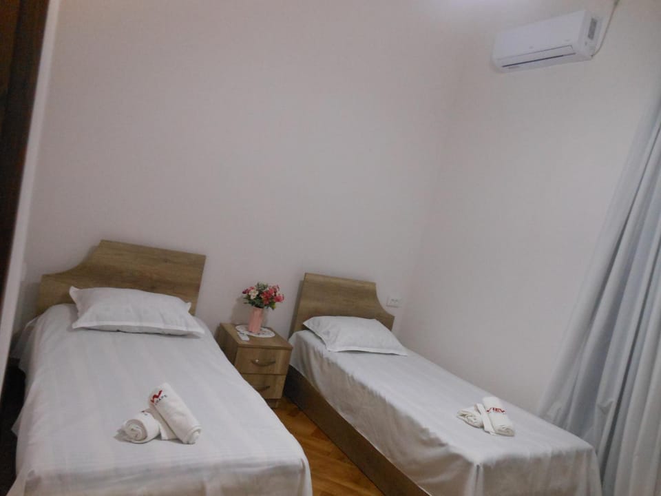 Bed, Photo of the whole room, Bedroom, towels, air conditioner