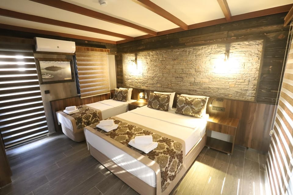 Bed, towels, wardrobe, air conditioner