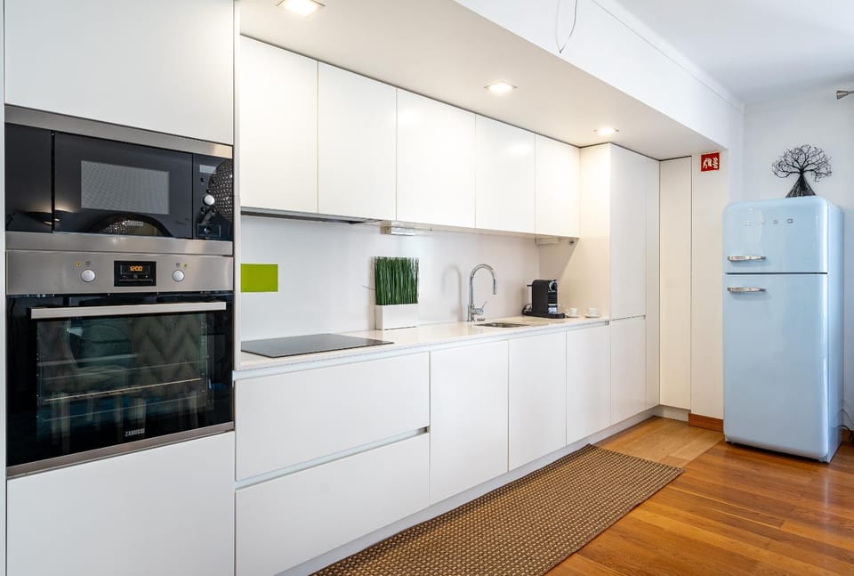 Kitchen or kitchenette, dishwasher, oven, stove, toaster