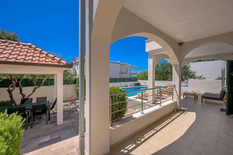 Balcony/Terrace, Seating area, Sea view, Swimming pool