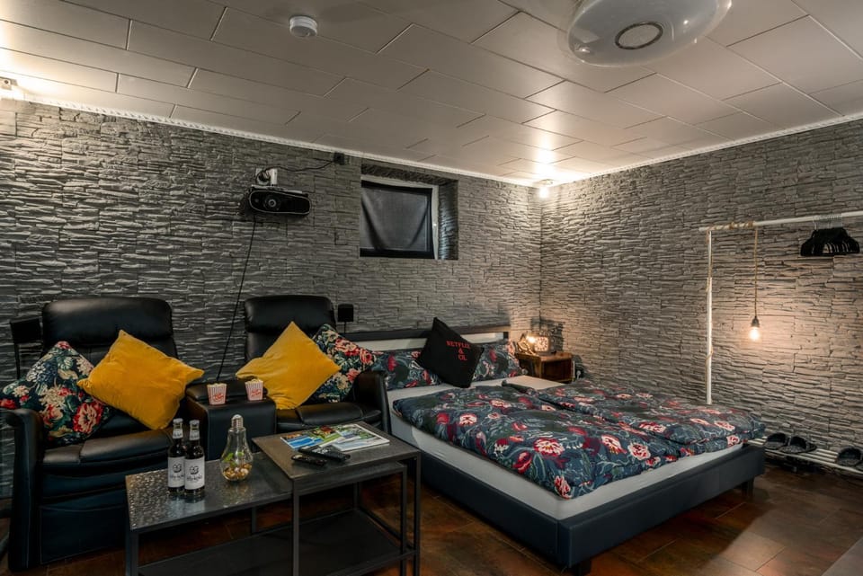 Bed, Living room, Seating area, Bedroom