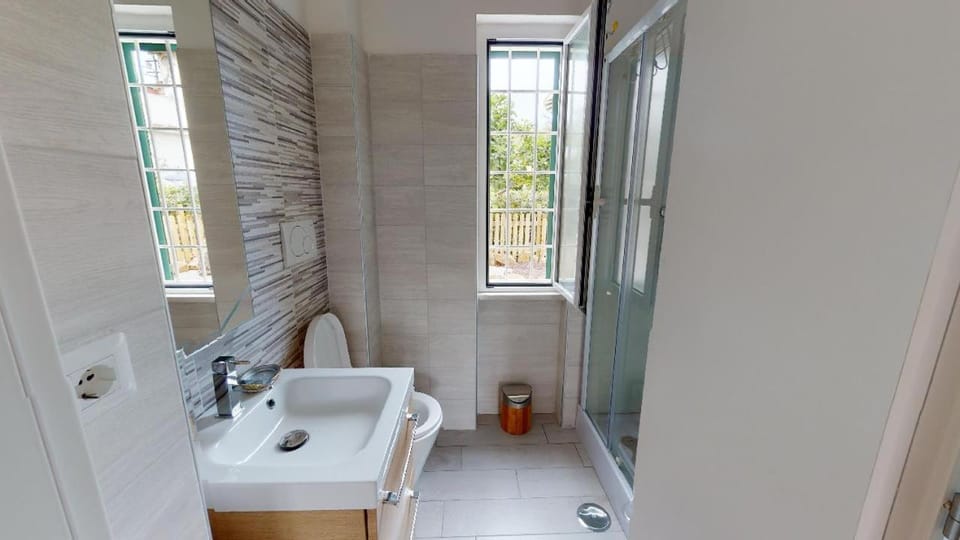 Shower, Toilet, Bathroom, hair dryier, towels, washing machine