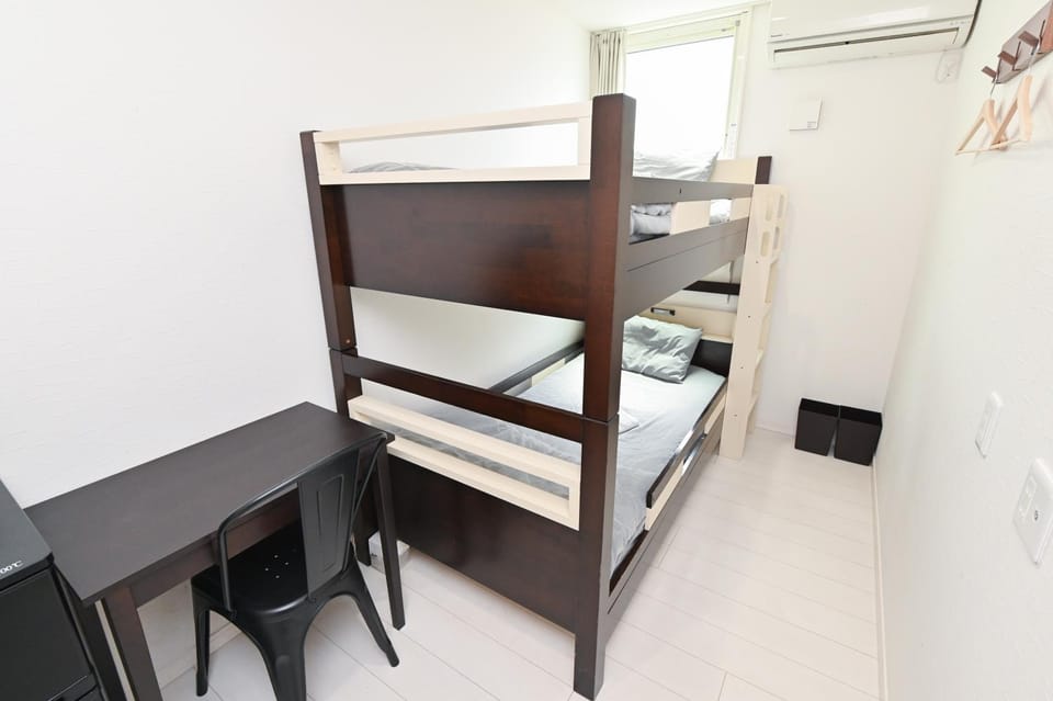 Photo of the whole room, bunk bed, air conditioner