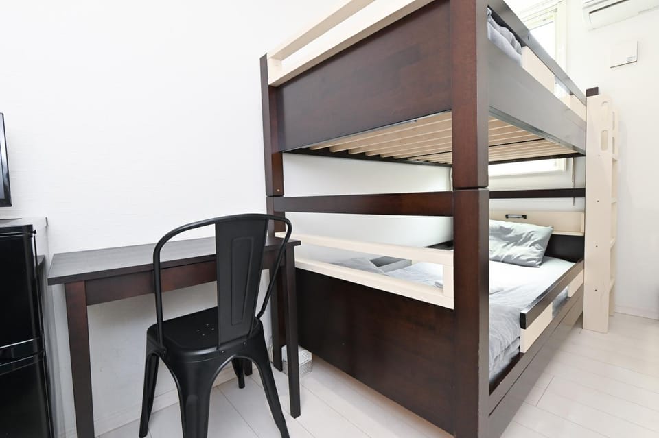 Photo of the whole room, bunk bed, air conditioner
