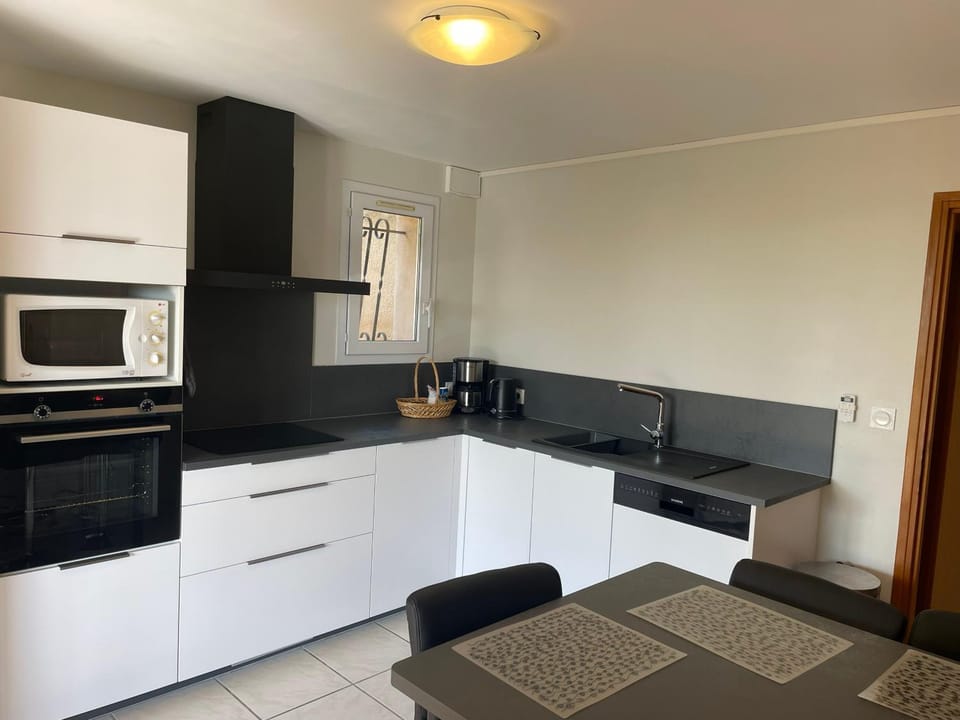 Kitchen or kitchenette, dishwasher, oven, stove, air conditioner