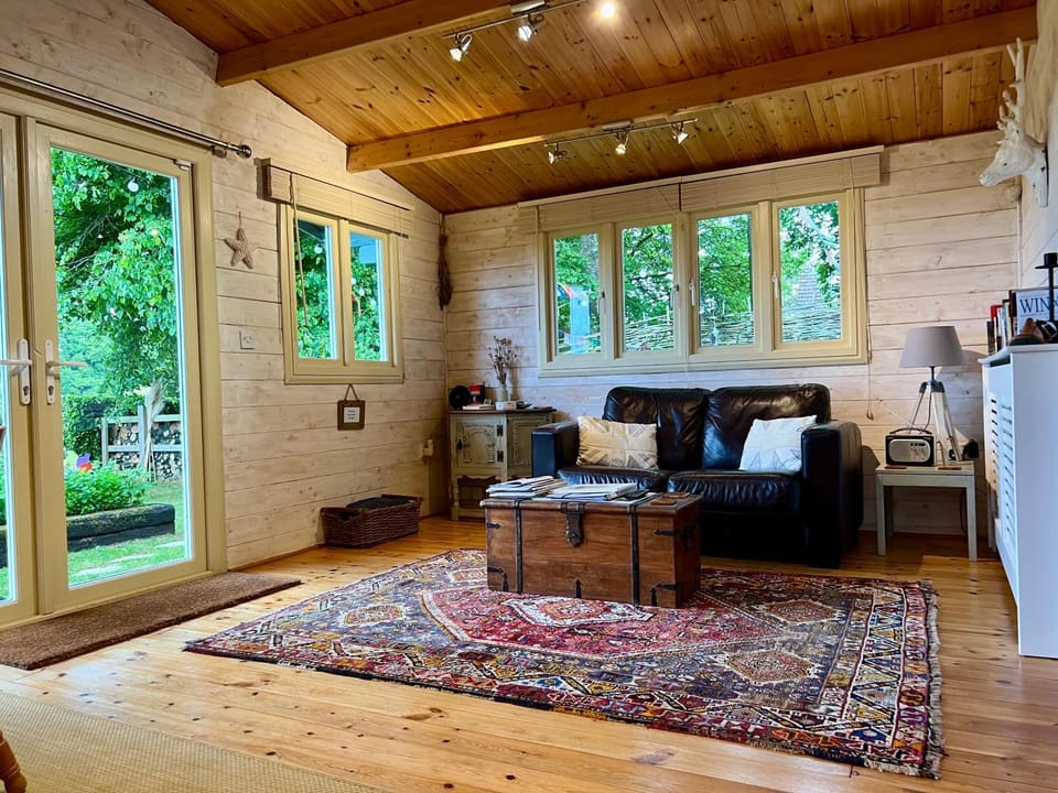 Property building, Living room, Seating area, Garden view