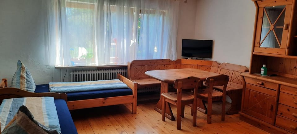 Bed, TV and multimedia, Living room, Seating area, Dining area
