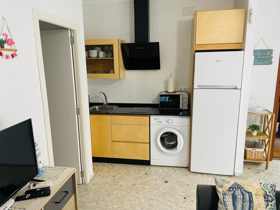 Kitchen or kitchenette, toaster, washing machine