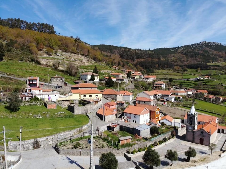 Property building, Nearby landmark, Spring, Day, Neighbourhood, Natural landscape, Bird's eye view, Mountain view, Street view