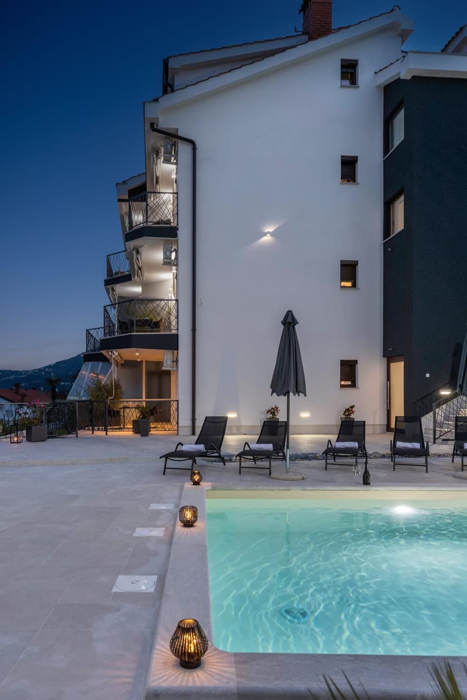 Property building, Patio, Night, Natural landscape, Pool view, Swimming pool, sunbed